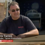 Man sitting at bench for TV interview